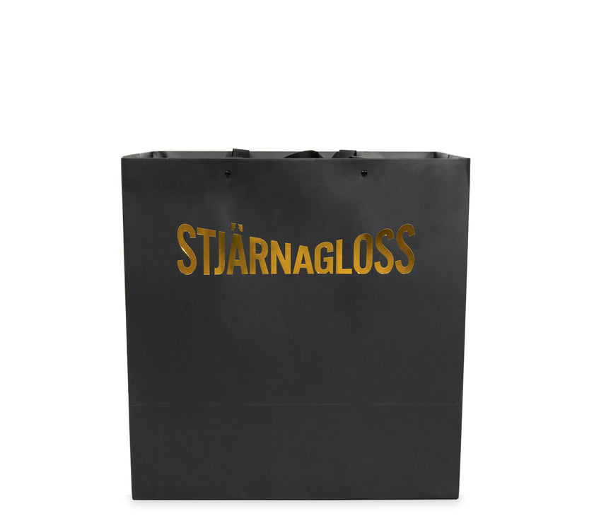 stjarnagloss gold and black gift bag