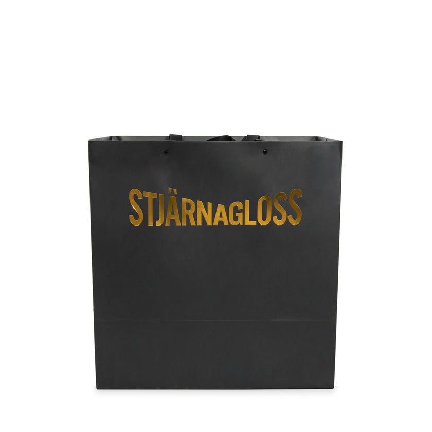 stjarnagloss gold and black gift bag