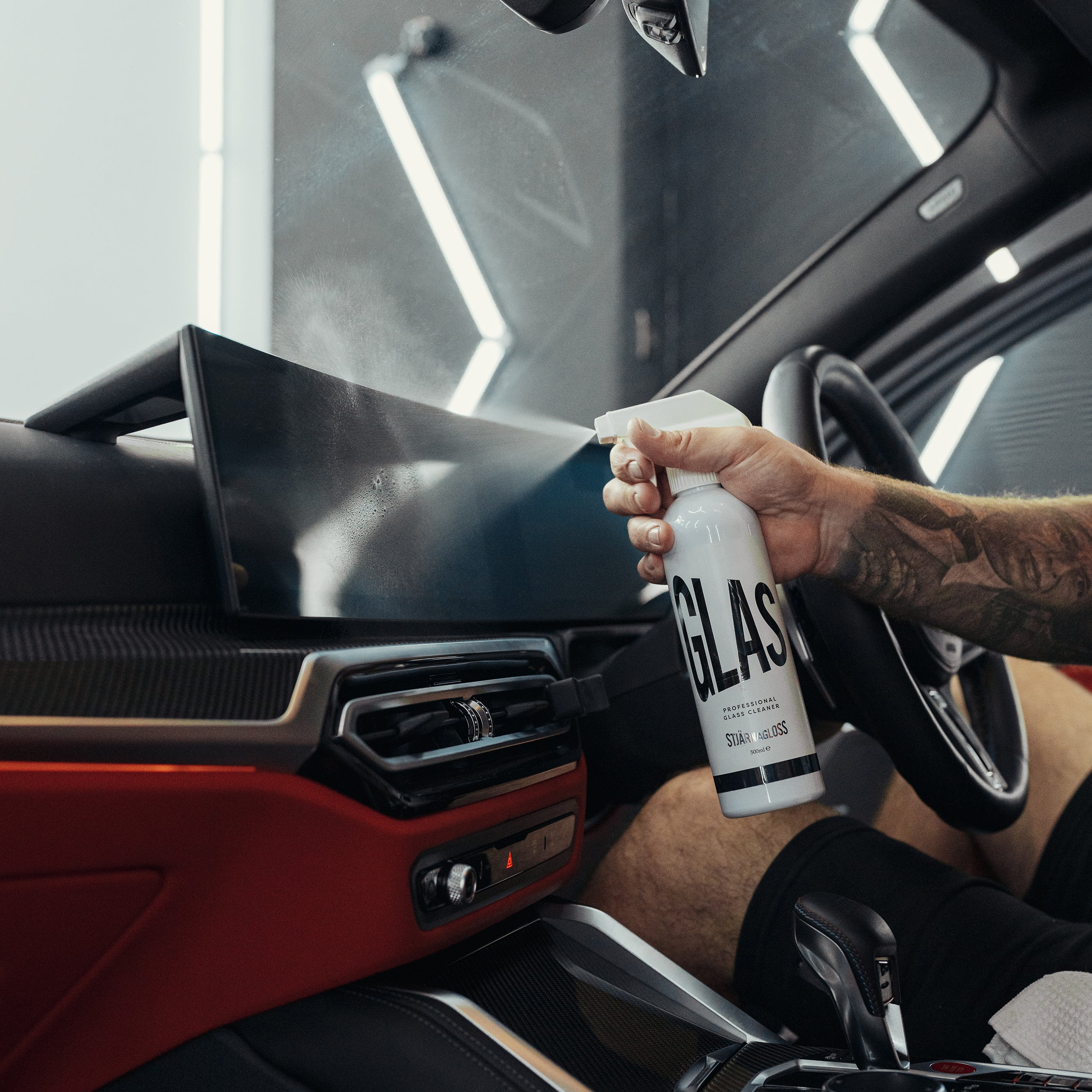 Glas being sprayed on interior car display