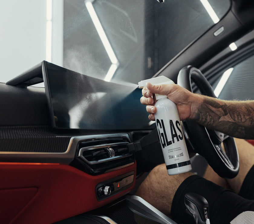 Glas being sprayed on interior car display